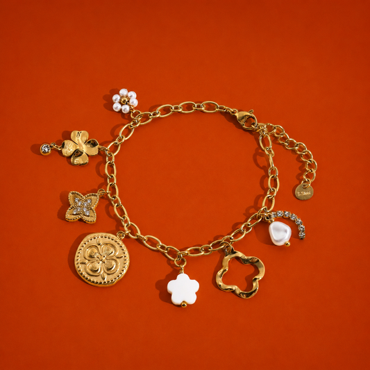 Bracelet doré à charms trèfles et perles effet bonheur