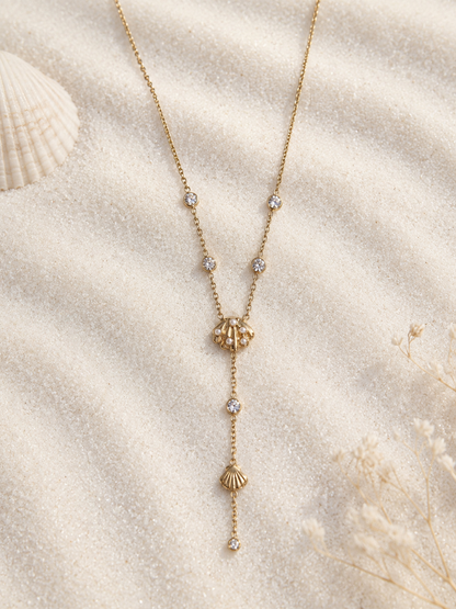 Collier doré en Y coquillage à pendentif strass