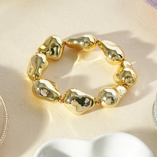 Bracelet doré élastique galets polis