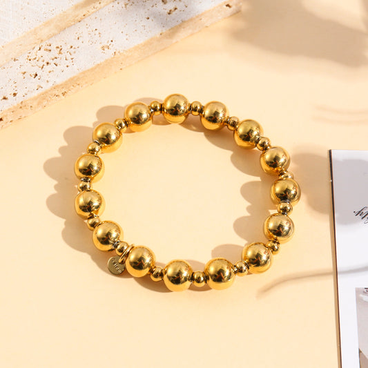 Bracelet élastique à grosses billes polies